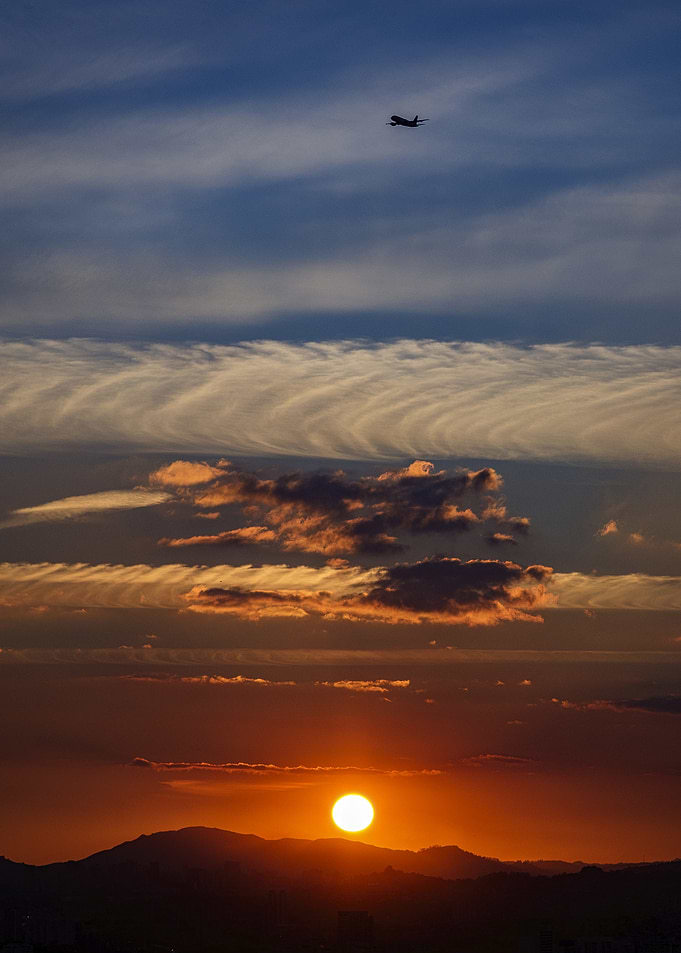 Final Approach with natural sunset cloud resembling aircraft
