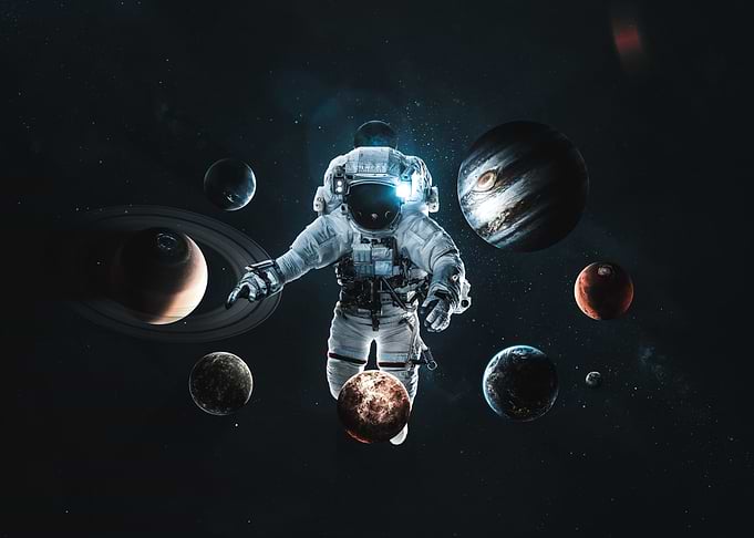 Astronaut Floating Among Planets