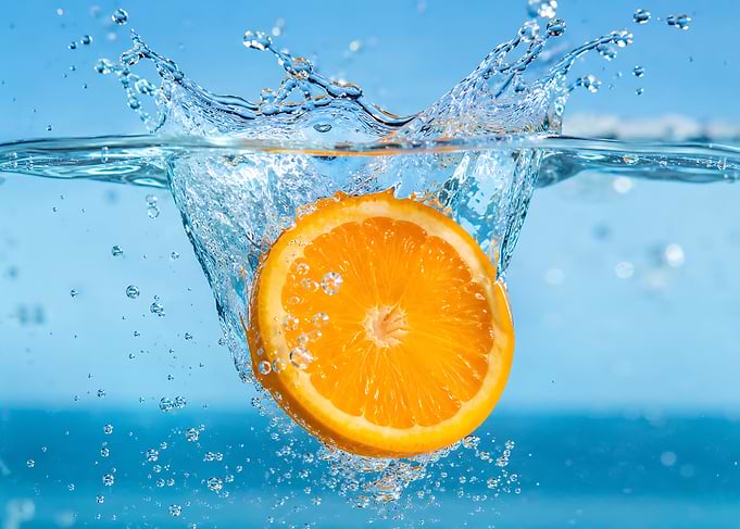 Orange Slice Splashing in Water