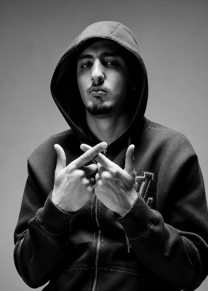 Young Man in Hoodie Making Gesture