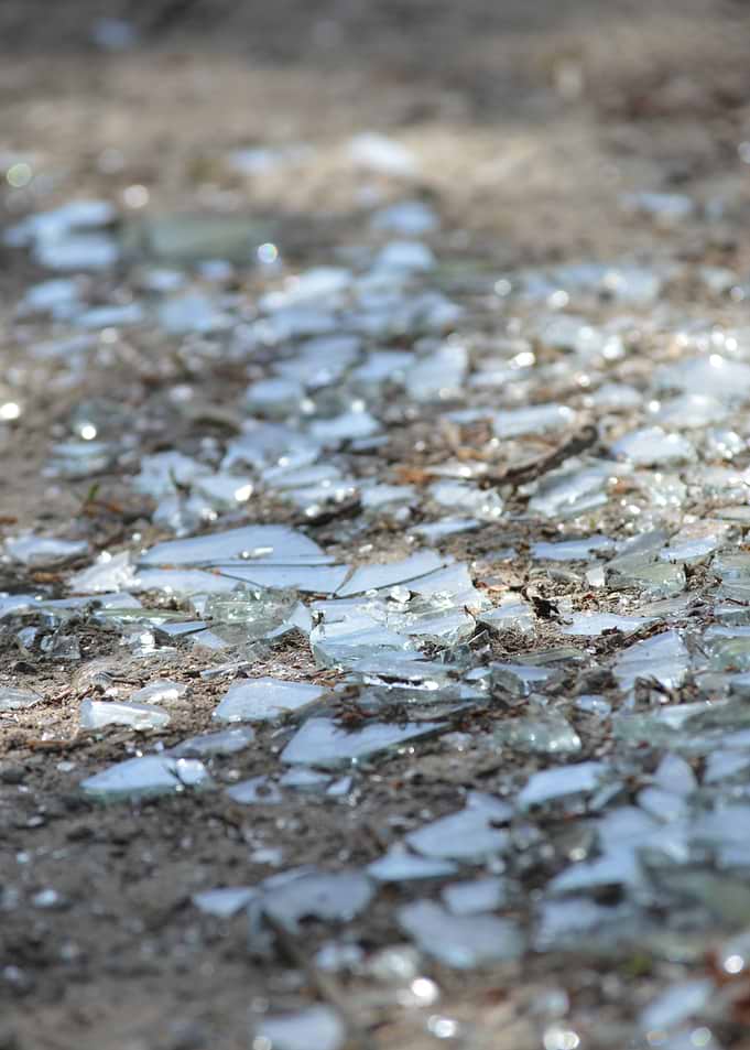 Shattered Glass Fragments on Ground