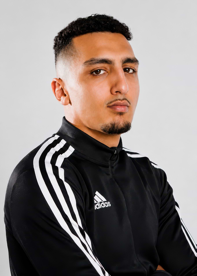 Young man in Adidas track jacket
