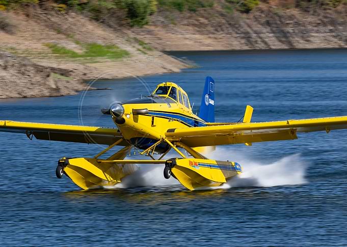 Yellow Seaplane Landing on Water