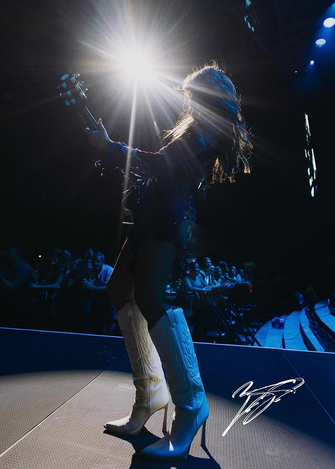Female Musician Performing on Stage