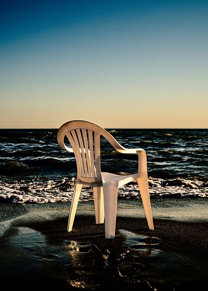 The White Plastic Chair on Beach