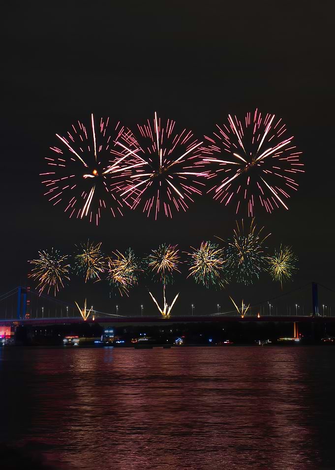 Fireworks Display Over Bridge at Night