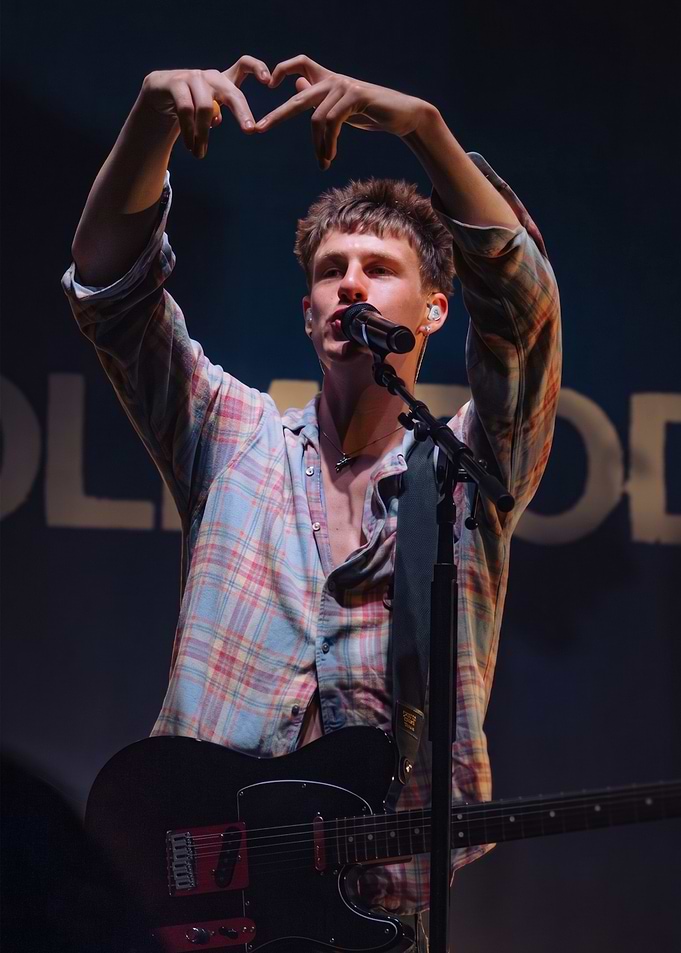 Musician Performing with Heart Gesture