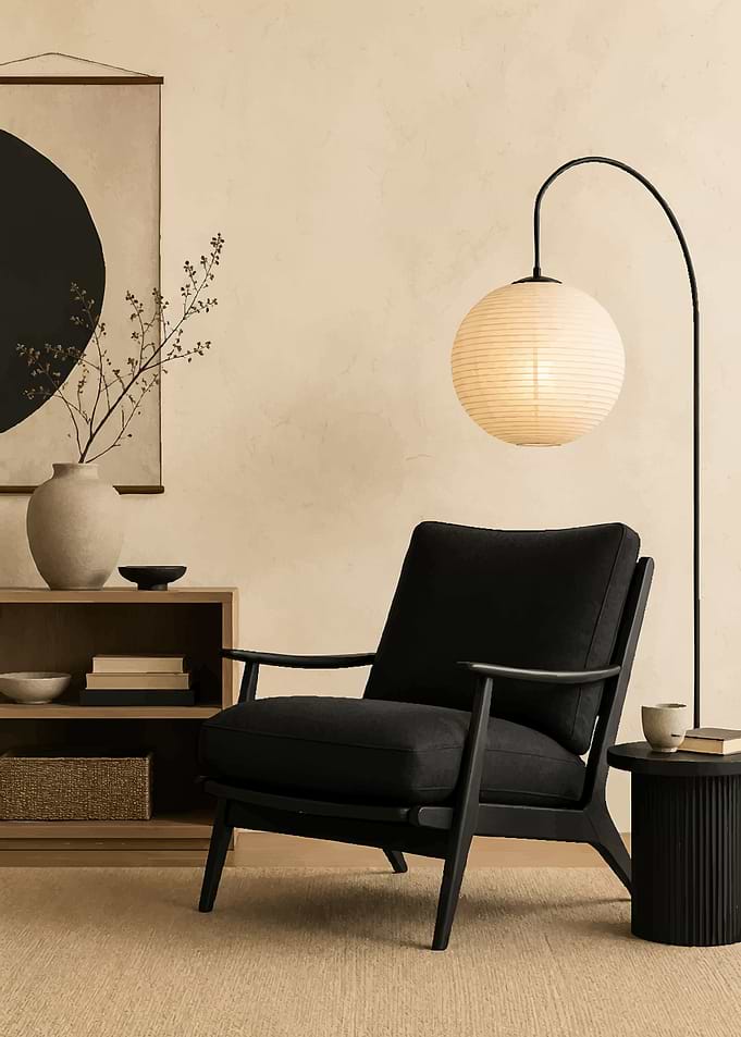 Minimalist Black Armchair and Paper Lamp