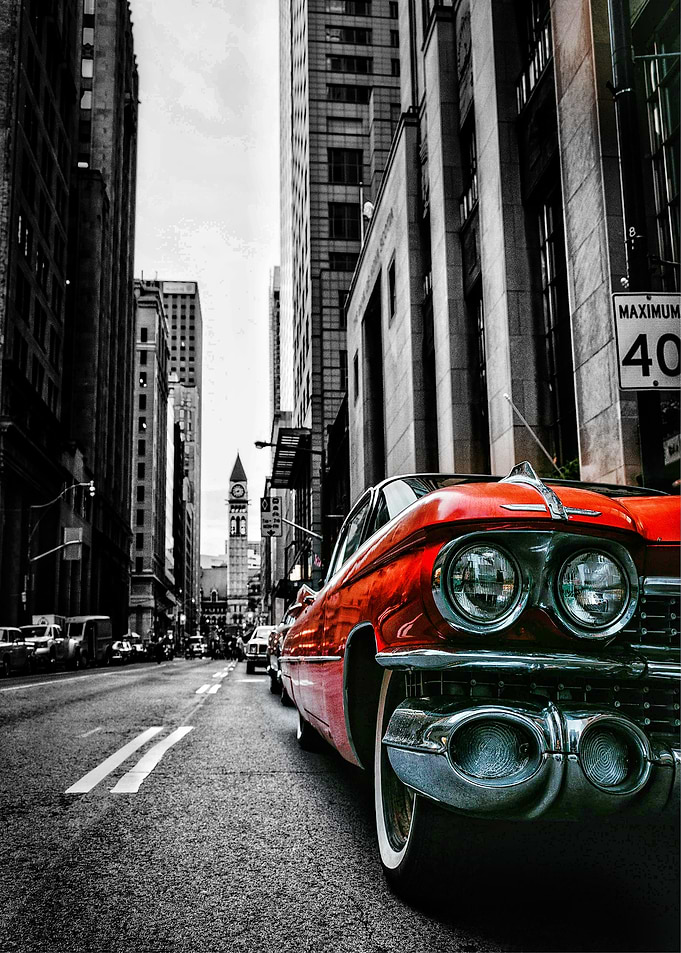 Vintage Red Cadillac in City Street