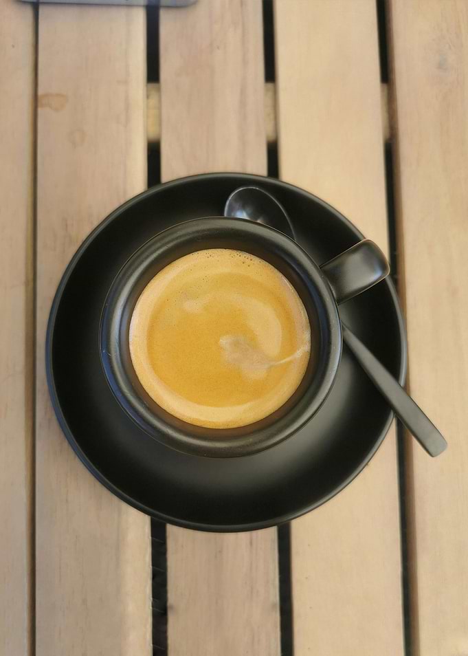 Top View of Espresso in Black Cup