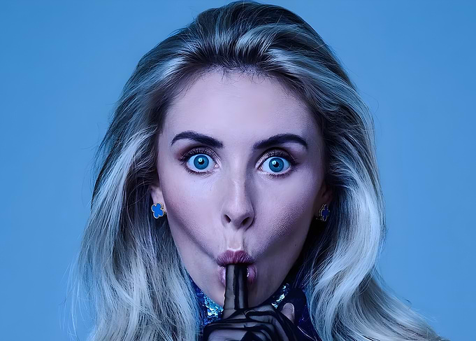 Blonde Woman Making Shushing Gesture