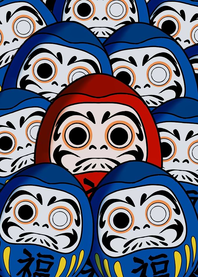 Red Daruma Among Blue Daruma Dolls
