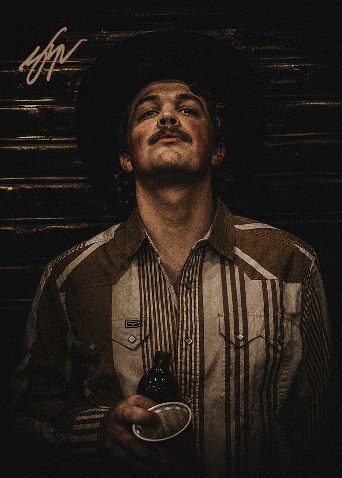 Portrait of a Zach Top Cowboy with Drink