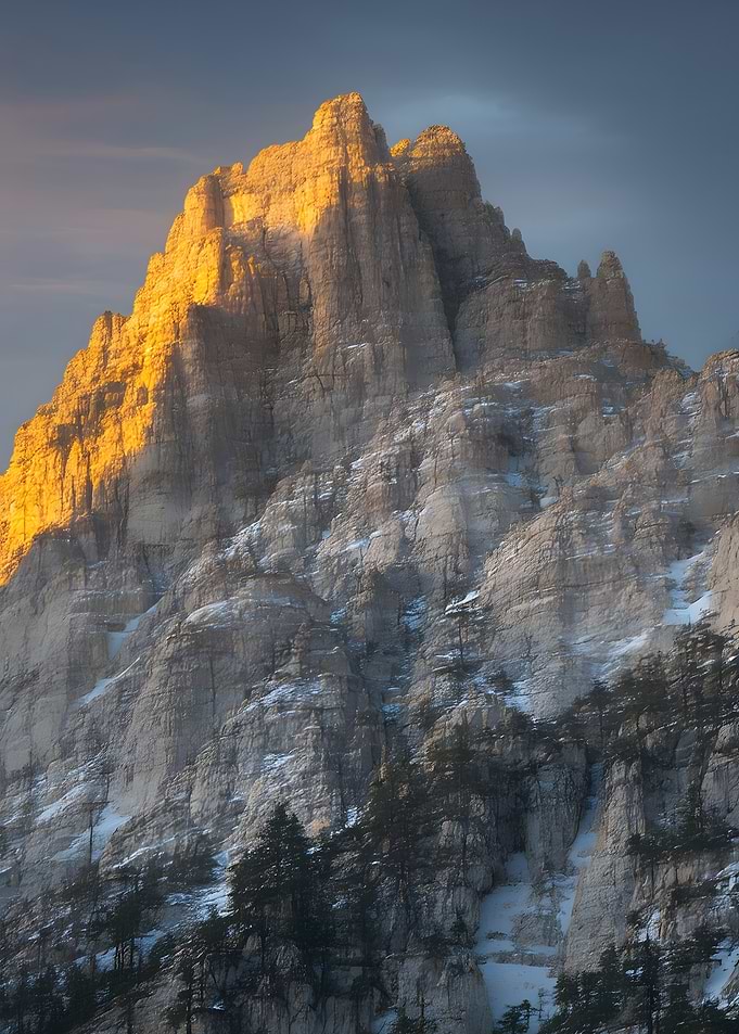 Golden Sunlight on Snowy Mountain Peak