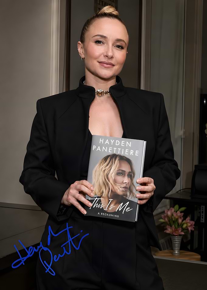 Hayden Panettiere Holding Her Book