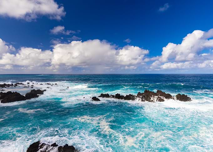 Turquoise Ocean Waves Crashing on Rocks