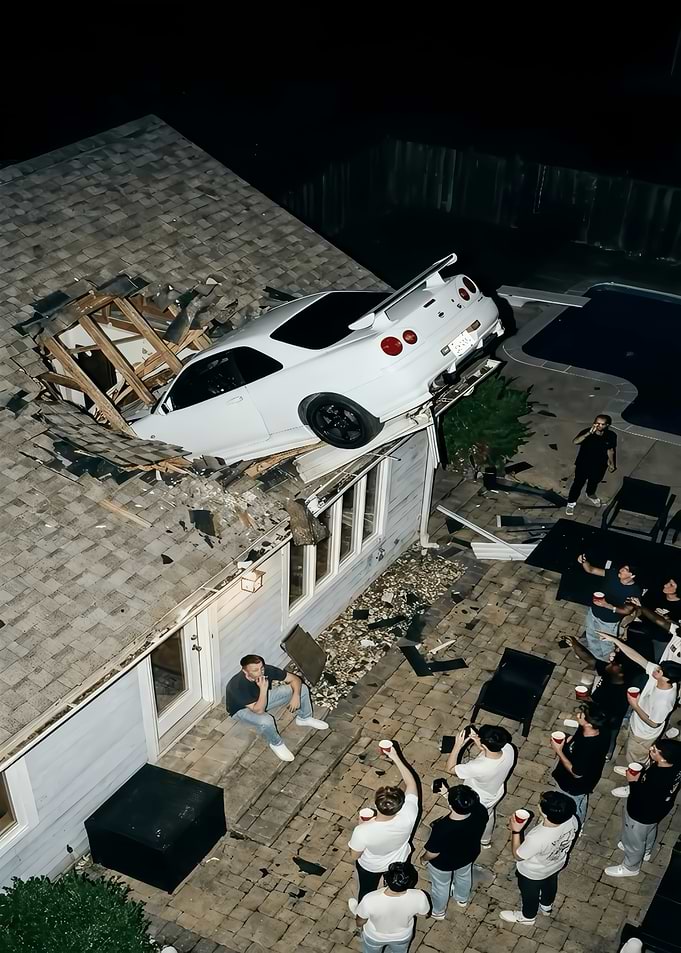 White Nissan Skyline Crashed Into House