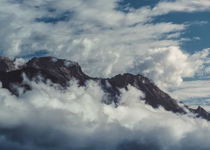 Majestic Mountain Peaks Above Clouds