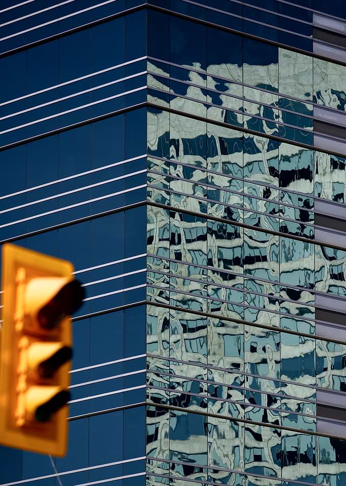Modern Skyscraper Reflection and Traffic Light