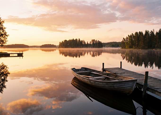 Rowboat at a Peaceful Lake Sunset