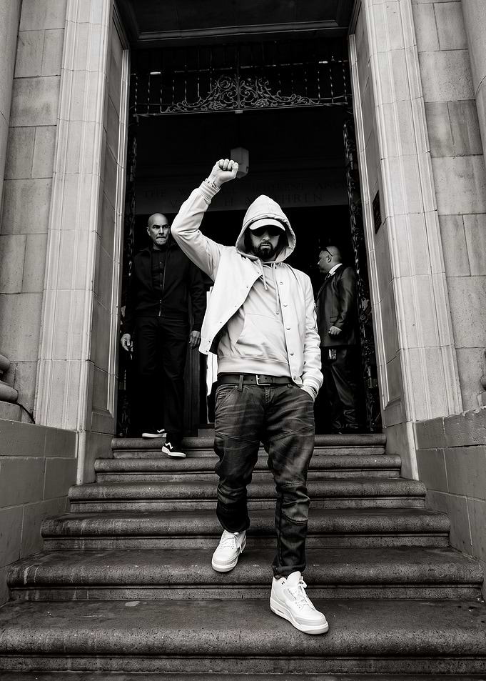 Eminem Raising Fist on Steps