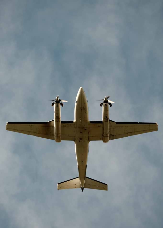 Twin-Engine Propeller Plane in Flight
