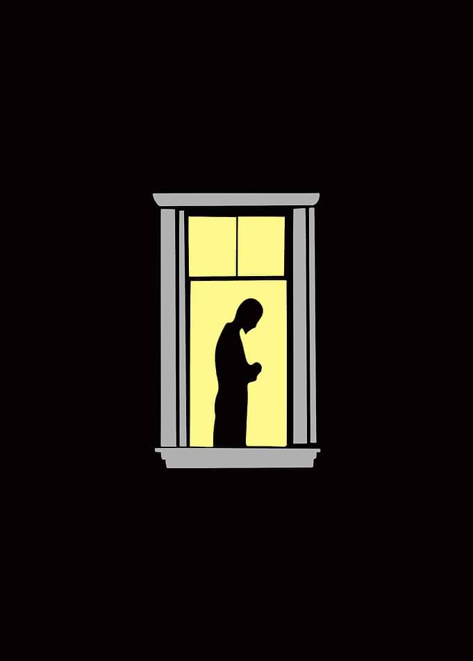 Silhouette of a person in window
