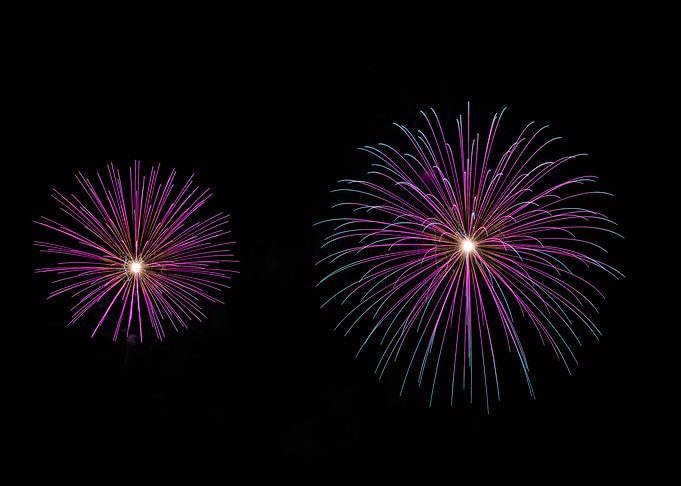 Two Vibrant Purple Fireworks Displays