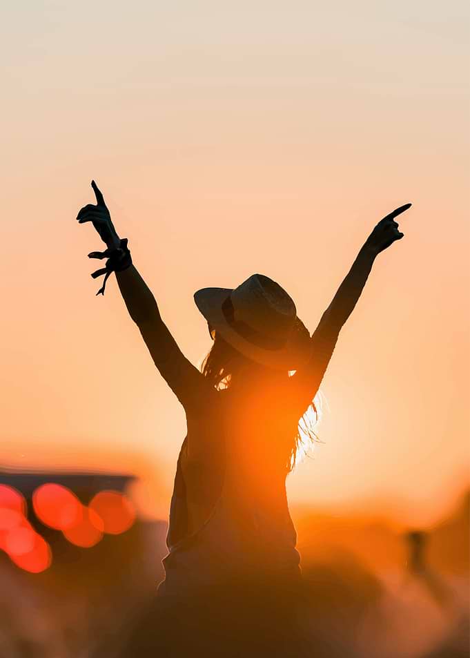 Woman Celebrating at Sunset Festival