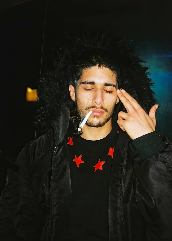 Young man in black star jacket