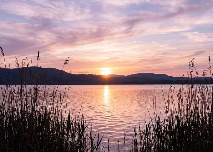 Serene Sunset Over Calm Lake