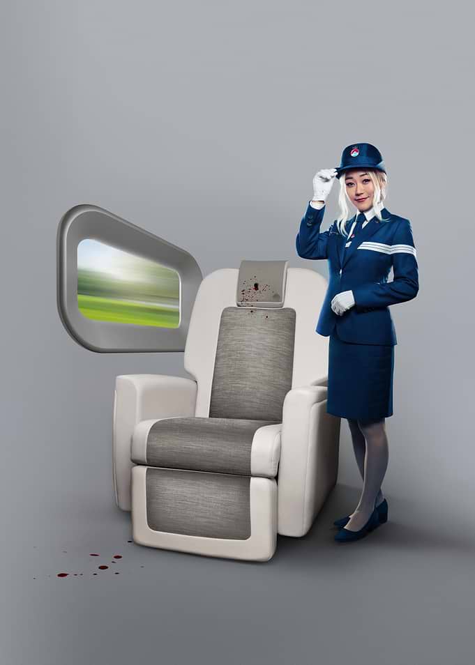 Flight Attendant Beside Bloodstained Airplane Seat