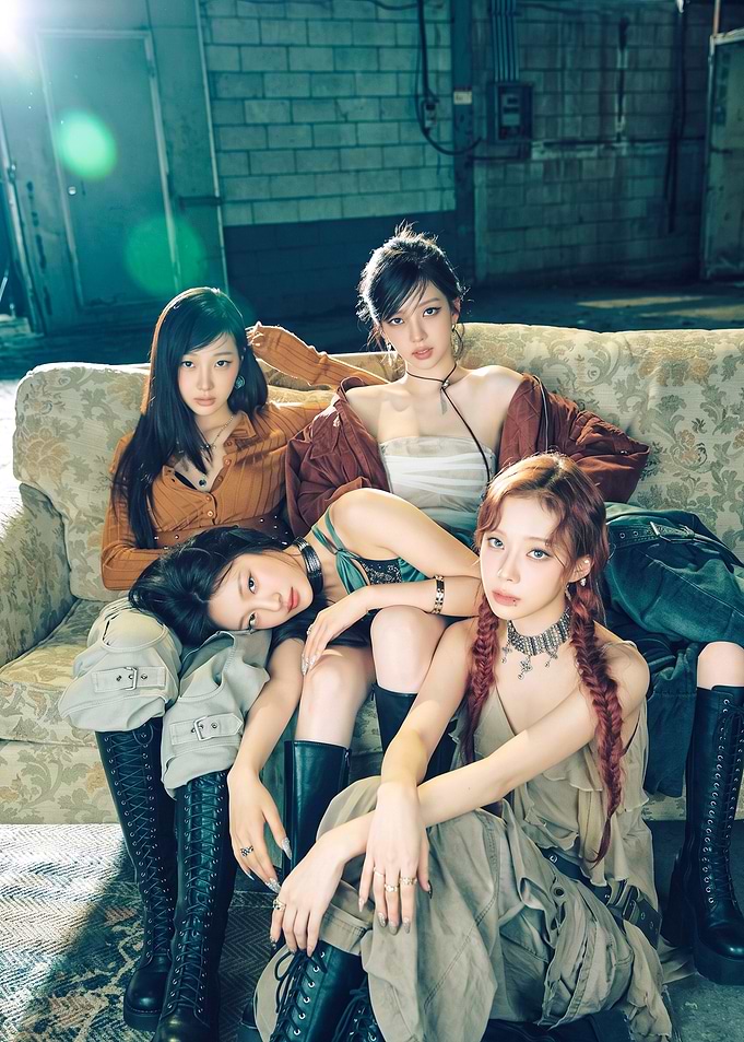 aespa members posing on vintage sofa
