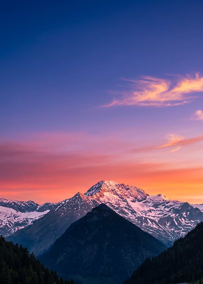 Snowy Mountain Peak at Sunset