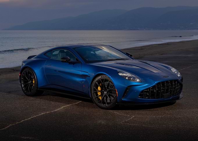 Blue Aston Martin Vantage on Beach