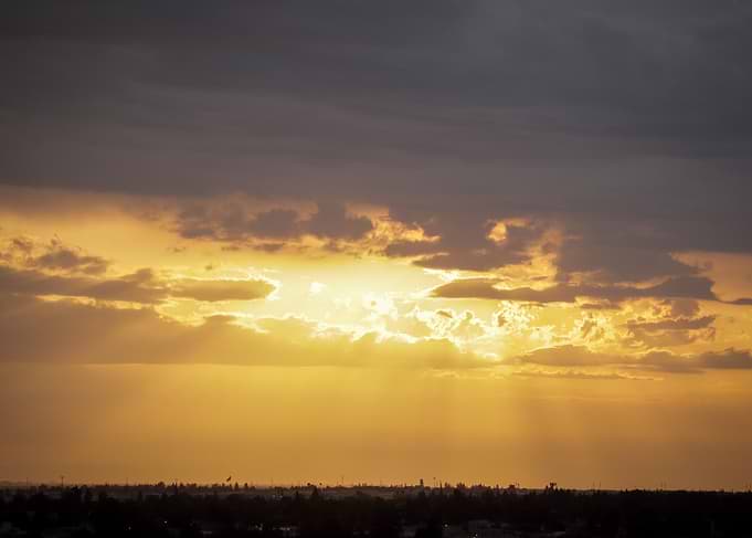 Golden Sunset Over Distant Horizon