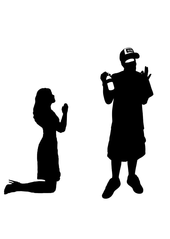 Silhouette of Woman Kneeling Before Man
