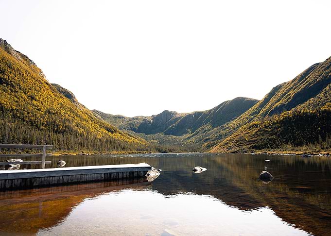 Serene Mountain Lake and Wooden Dock