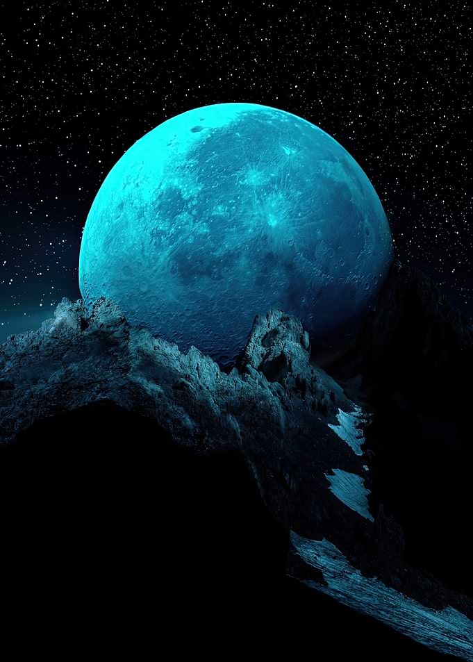 Giant Blue Moon Over Mountain Peaks