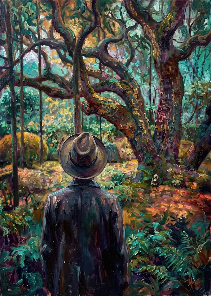 Man in Hat Facing Ancient Forest