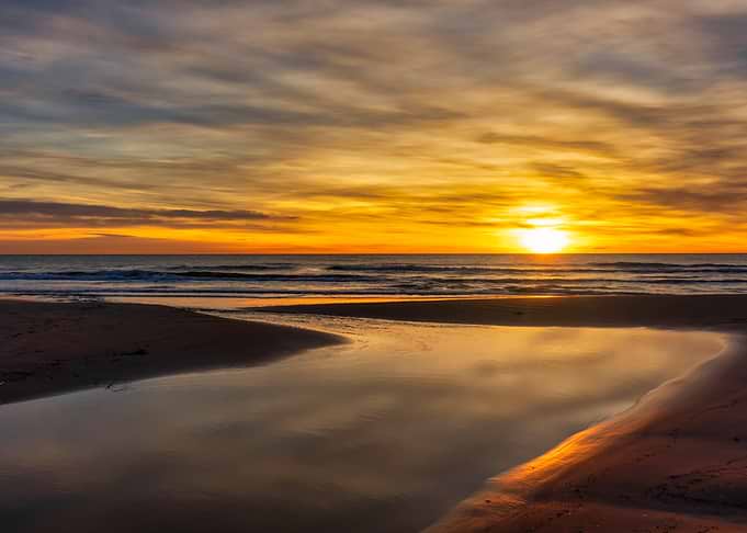 Golden Sunset Over Sandy Beach