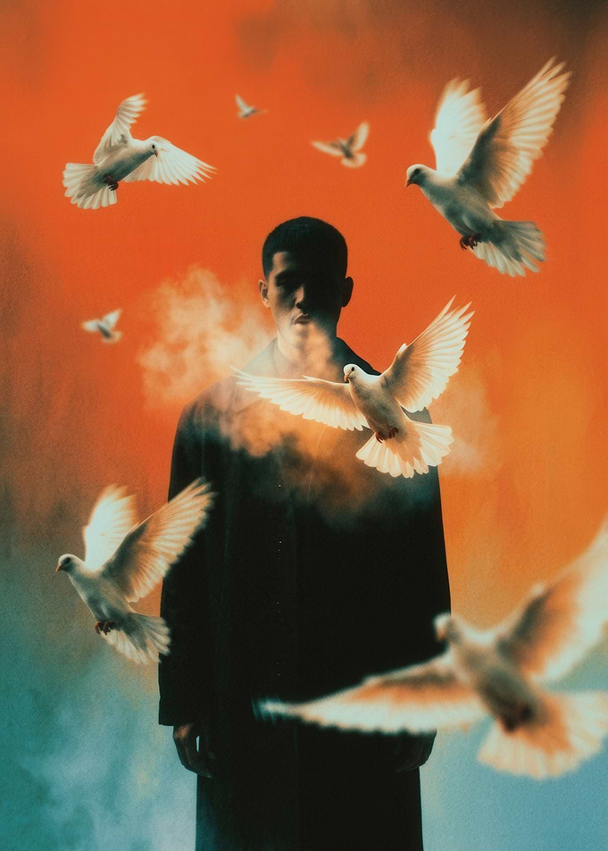 Man Surrounded by Flying White Doves