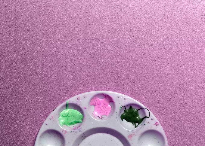 Paint Palette on Textured Purple Background