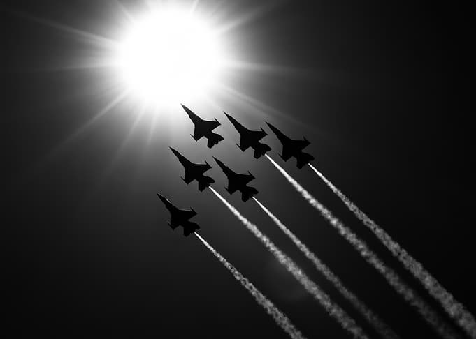 Fighter Jet Formation Against Sun