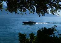 Speedboat cruising on a calm lake Leman