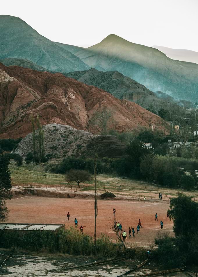 Soccer Match in Andean Landscape