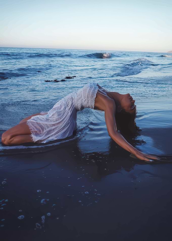 Woman in white dress on beach