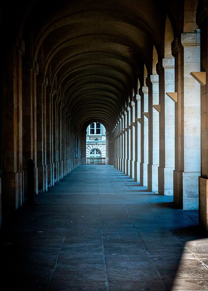 Symmetrical Stone Archway Corridor