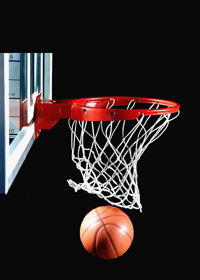 Basketball falling through the hoop