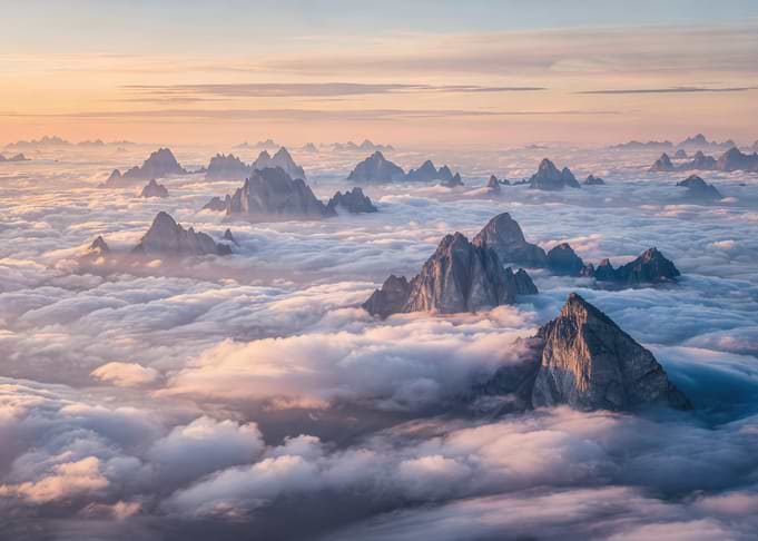 Majestic Mountain Peaks Above Clouds